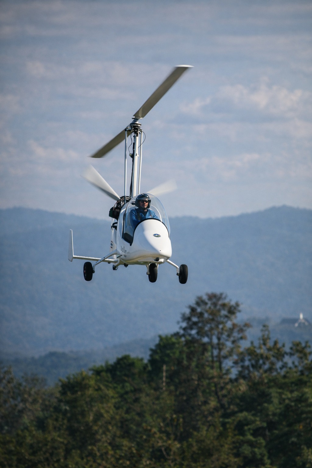 Gyrocopter climbing over the mountains
