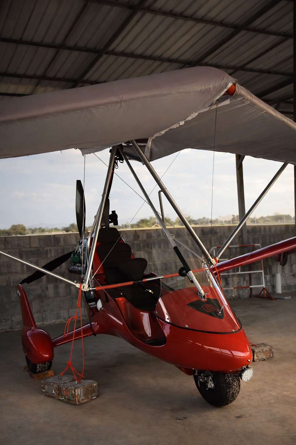 Red trike in the hangar